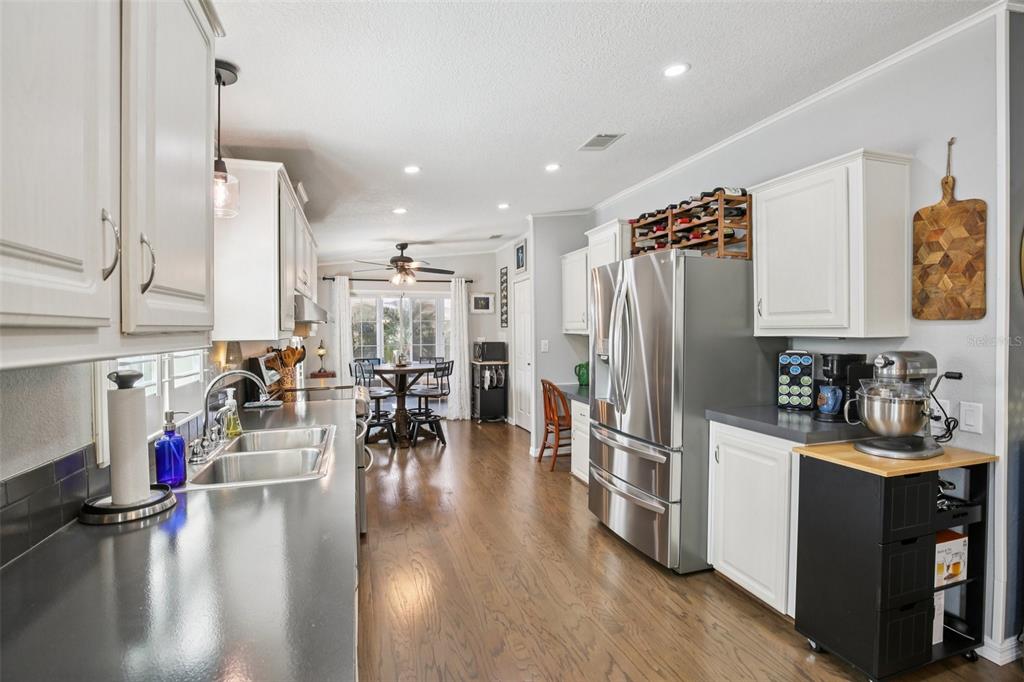 358 Lake Way Oldsmar, FL 34677 - Photo 11 of 48 a kitchen with stainless steel appliances granite countertop a refrigerator and a sink