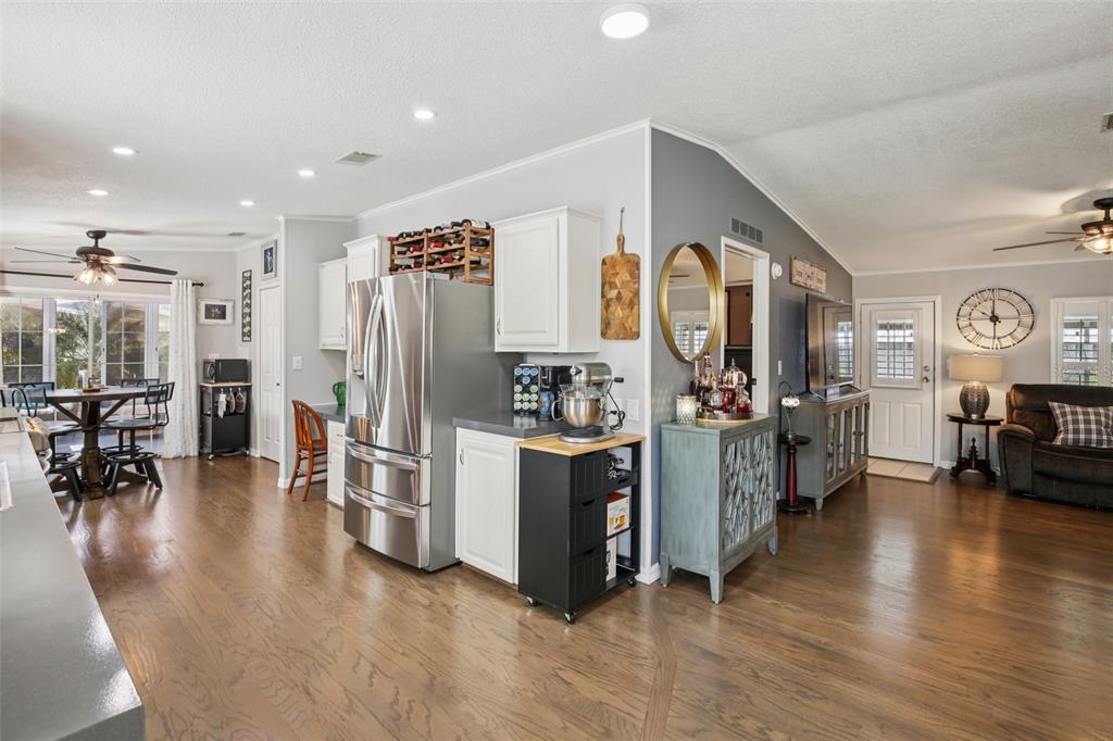 358 Lake Way Oldsmar, FL 34677 - Photo 12 of 48 a view of a kitchen with furniture and a refrigerator