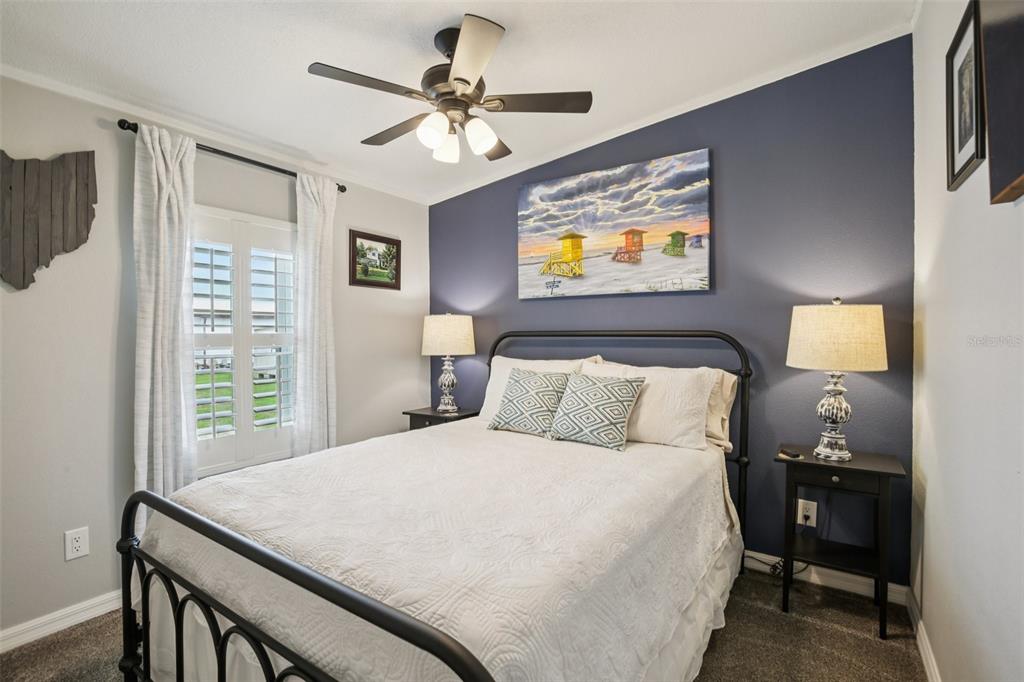 358 Lake Way Oldsmar, FL 34677 - Photo 22 of 48 a bedroom with a bed and a desk