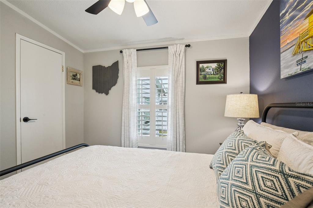 358 Lake Way Oldsmar, FL 34677 - Photo 23 of 48 a bedroom with a bed and a television