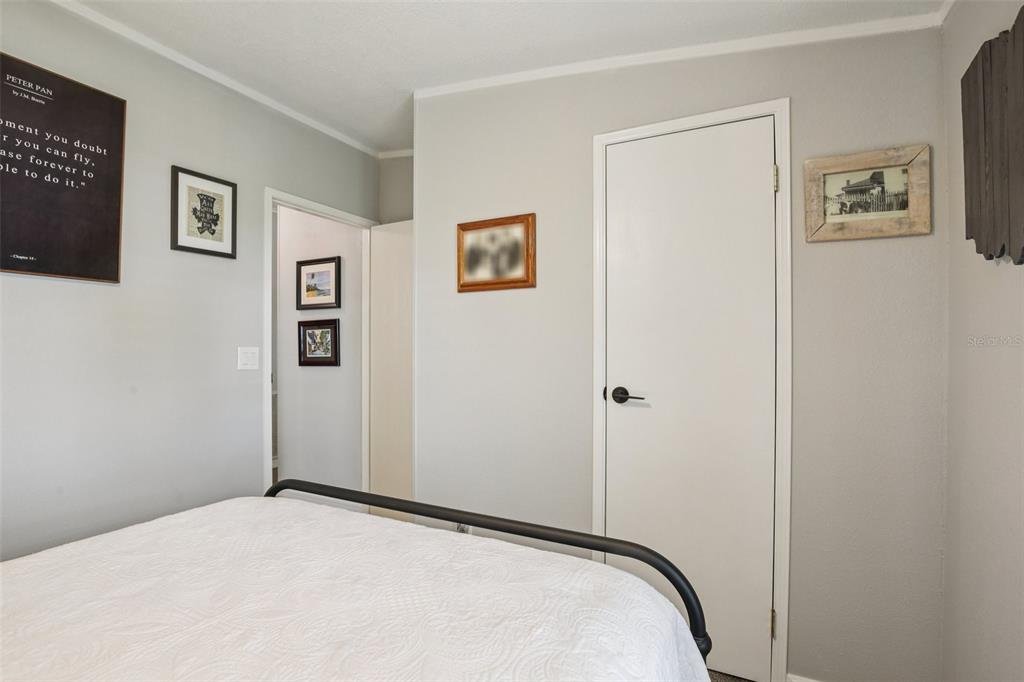 358 Lake Way Oldsmar, FL 34677 - Photo 24 of 48 a bedroom with a bed and a view of bathroom