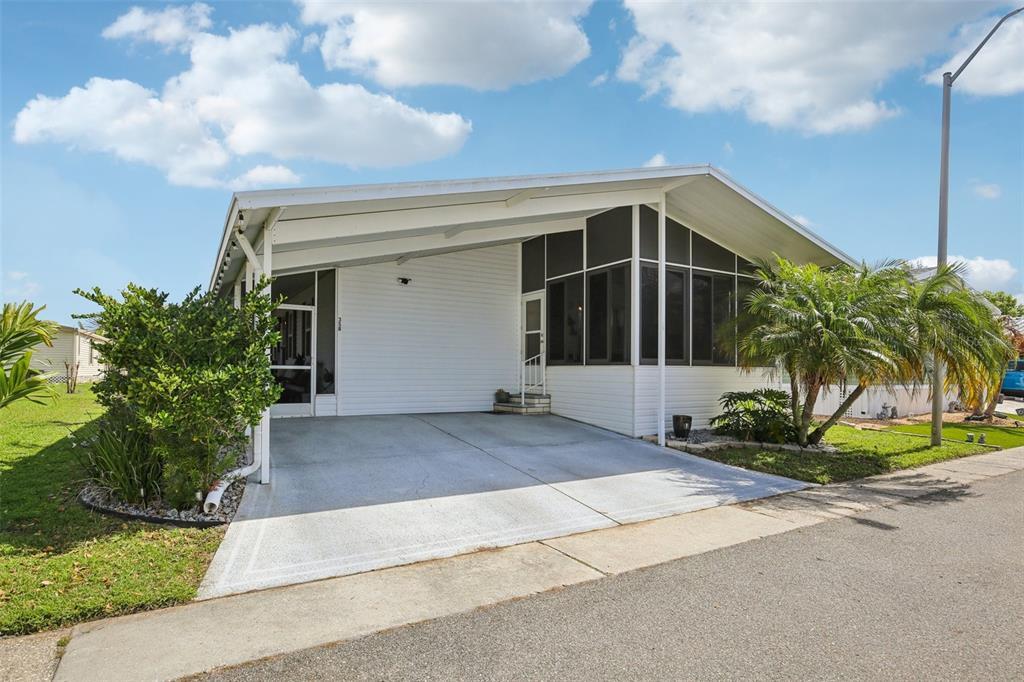 358 Lake Way Oldsmar, FL 34677 - Photo 3 of 48 a view of a house with a yard