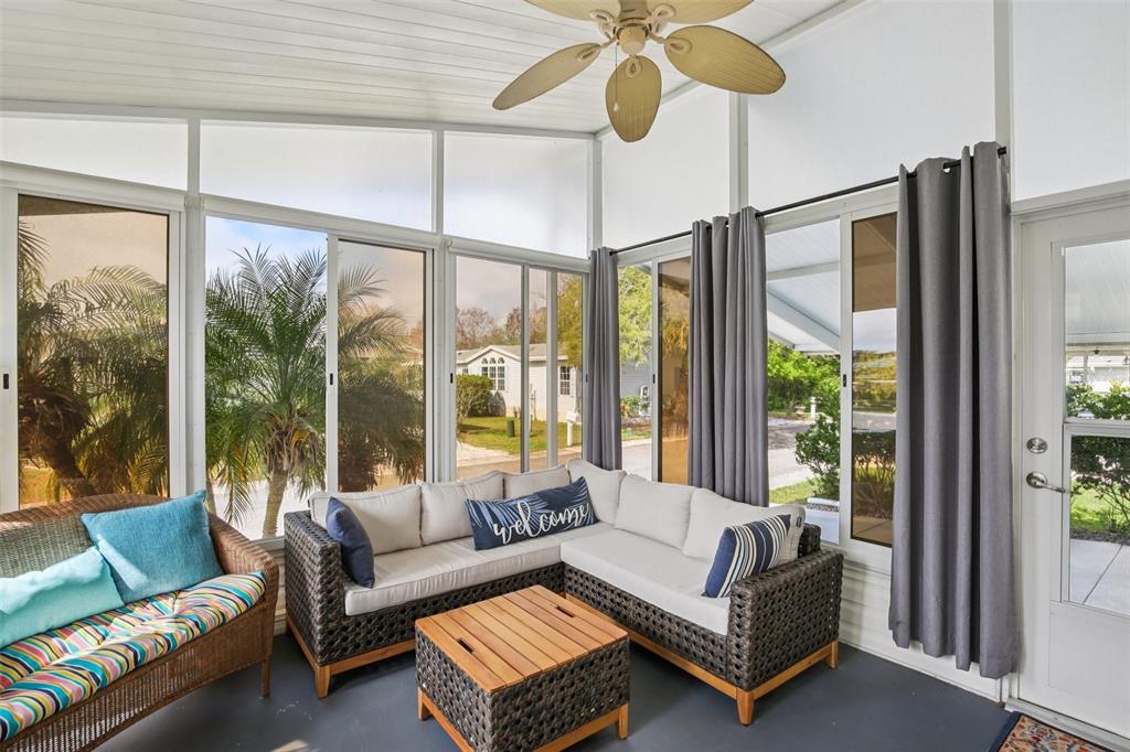 358 Lake Way Oldsmar, FL 34677 - Photo 32 of 48 a living room with furniture and a large window