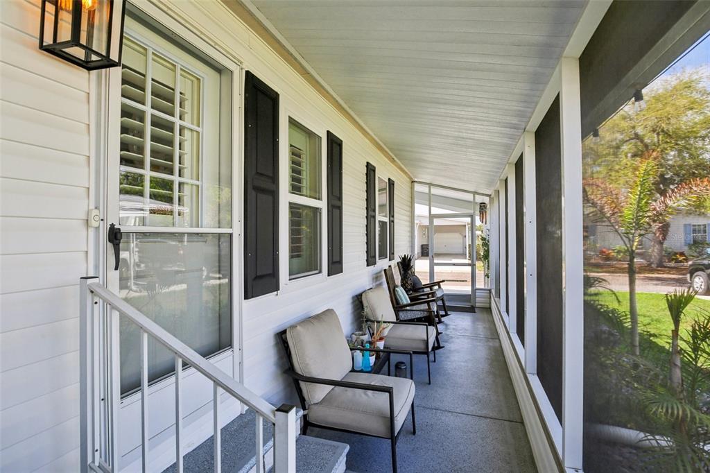 358 Lake Way Oldsmar, FL 34677 - Photo 4 of 48 a balcony with furniture and a potted plant