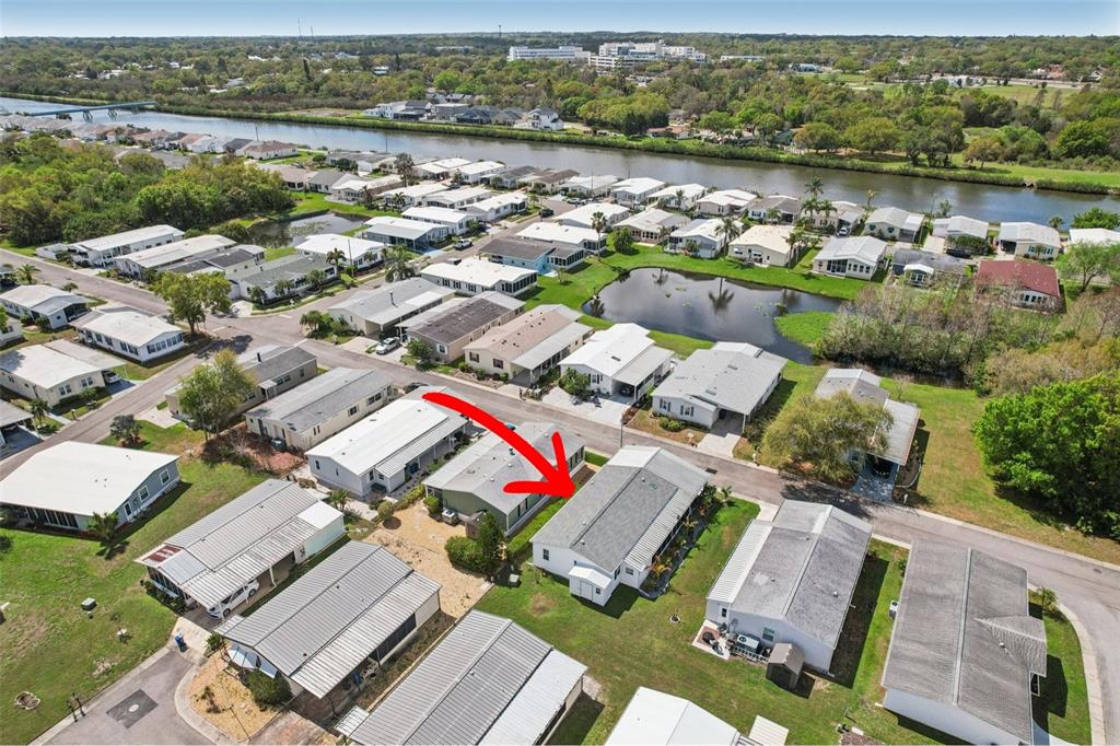 358 Lake Way Oldsmar, FL 34677 - Photo 42 of 48 an aerial view of a house with a lake view