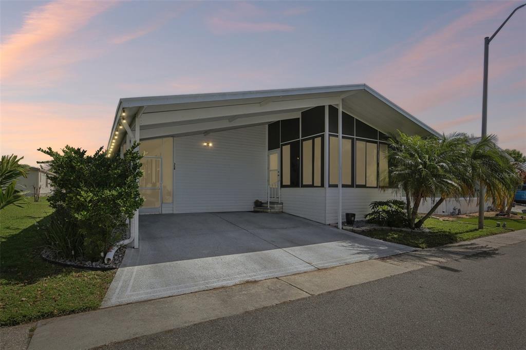 358 Lake Way Oldsmar, FL 34677 - Photo 48 of 48 a front view of a house with yard and garage