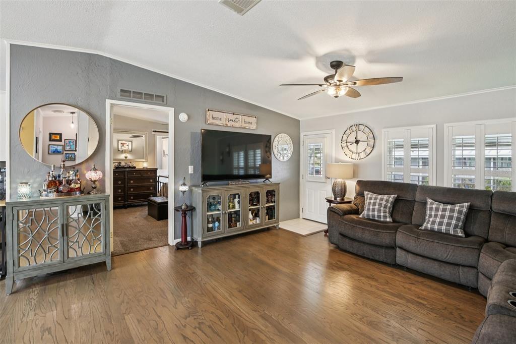 358 Lake Way Oldsmar, FL 34677 - Photo 6 of 48 a living room with furniture and a flat screen tv