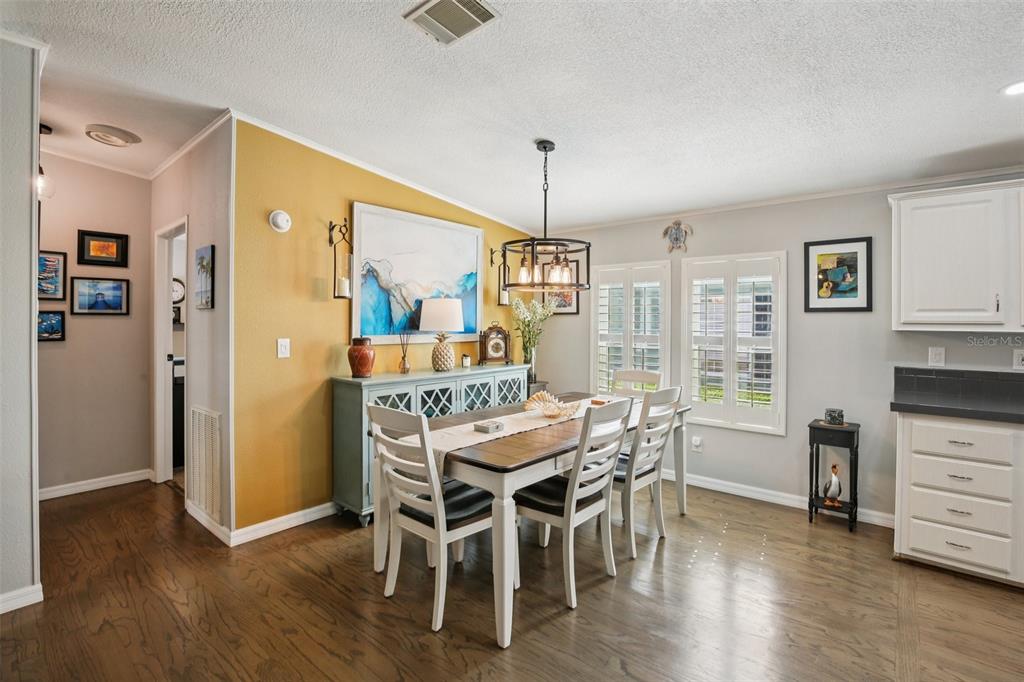 358 Lake Way Oldsmar, FL 34677 - Photo 10 of 48 a view of a dining room with furniture window and wooden floor