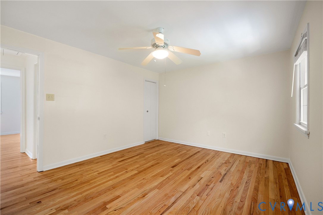 9129 Derbyshire Road, Unit E Henrico, VA 23229 - Photo 26 of 36 Spacious room featuring wood-finish flooring, ligh