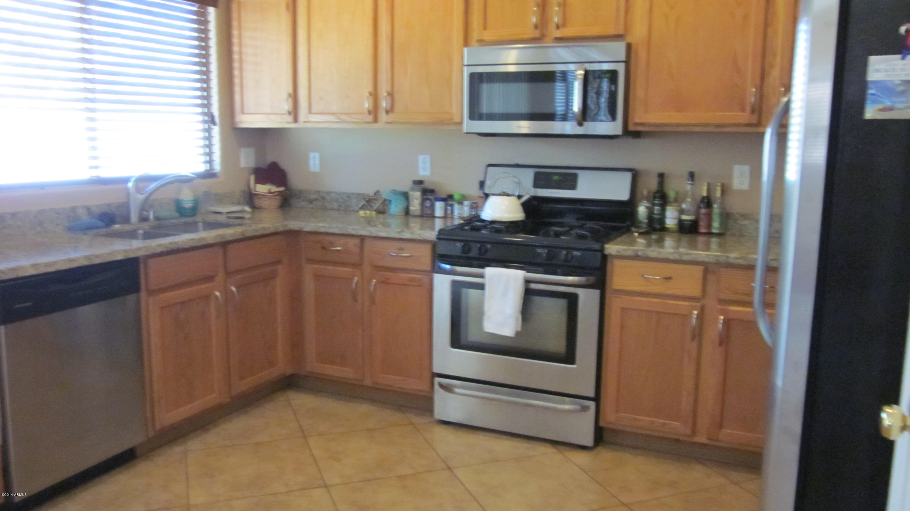 14638 West Redfield Road Surprise, AZ 85379 - Photo 10 of 30 KITCHEN FROM FAMILY ROOM