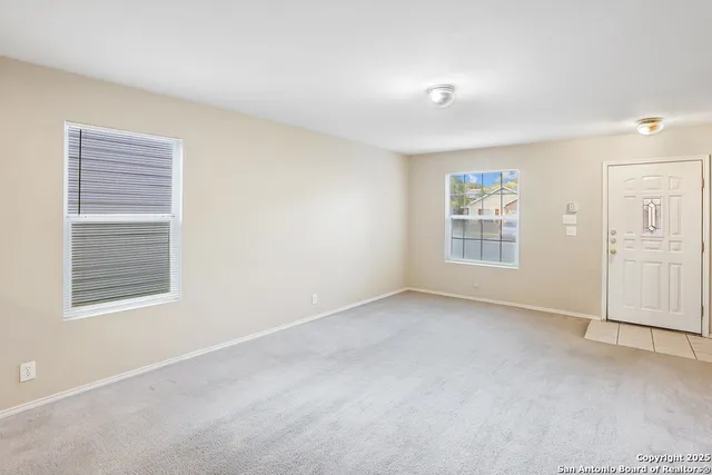 an empty room with windows