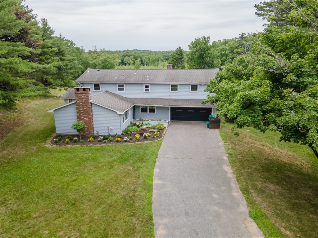 124 Everett Street Natick, MA 01760 - Photo 1 of 36 an aerial view of a house with a yard and lake view