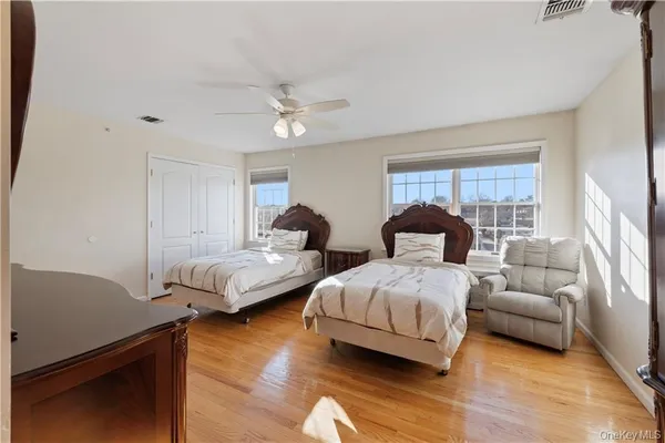 a bedroom with bed and window