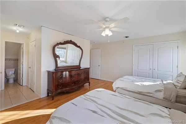 a bedroom with a bed and a dresser