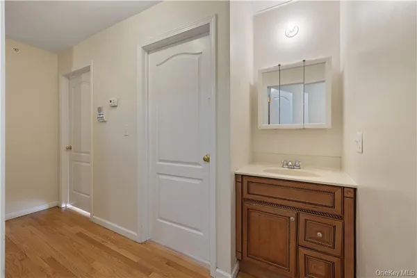 a view of cabinets and wooden floor