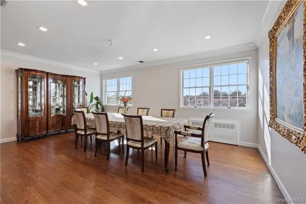 a dining room with furniture window wooden floor
