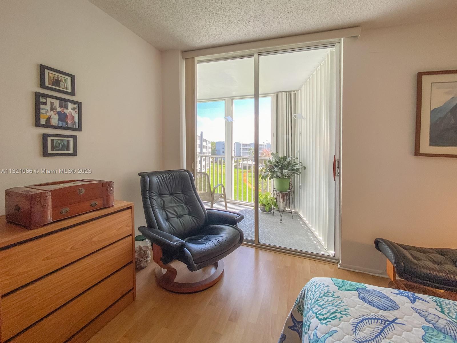 250 Northwest 67th Street, Unit 417 Boca Raton, FL 33487 - Photo 13 of 27 a living room with furniture and a window