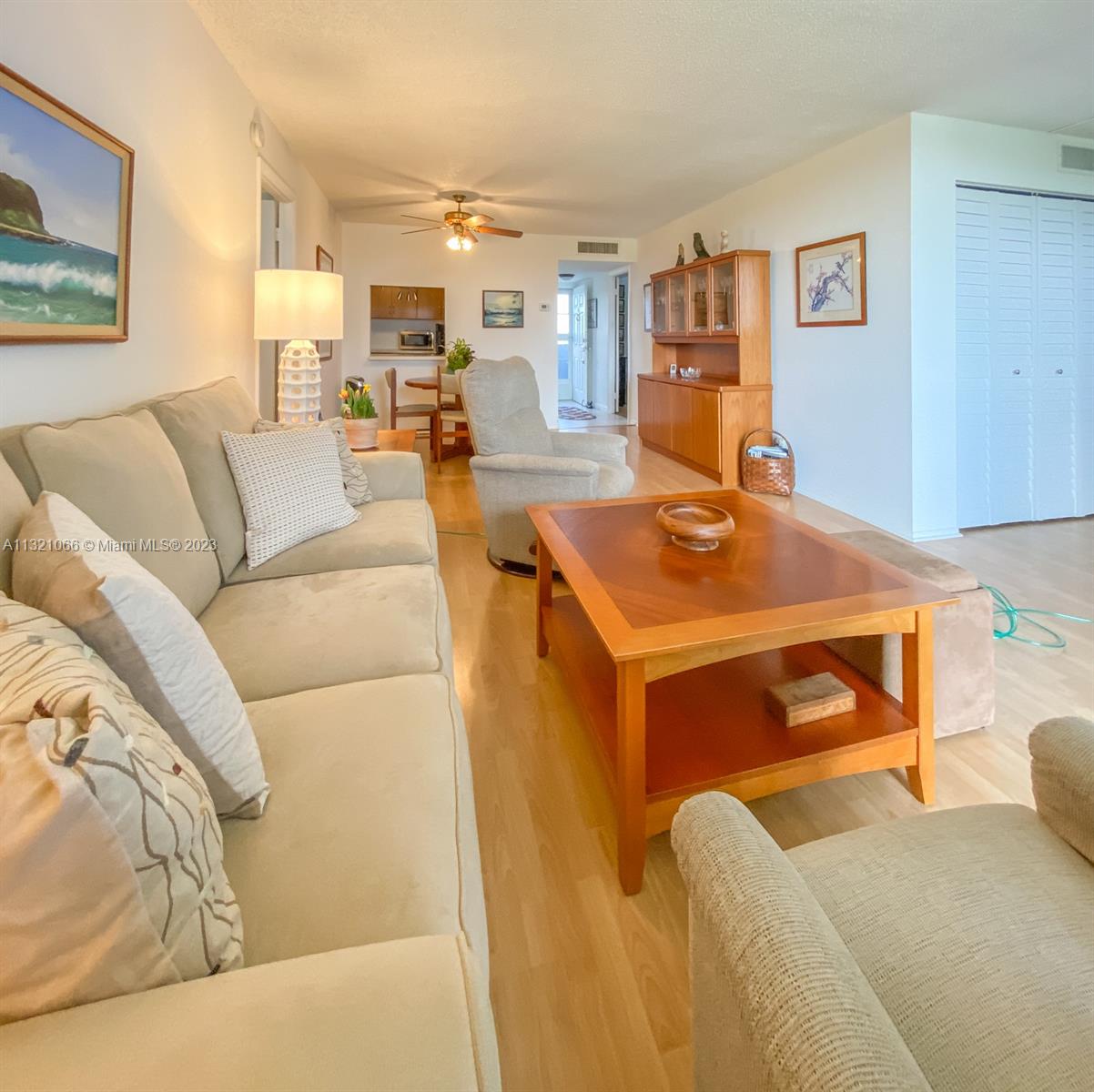 250 Northwest 67th Street, Unit 417 Boca Raton, FL 33487 - Photo 18 of 27 a living room with a couch and a table