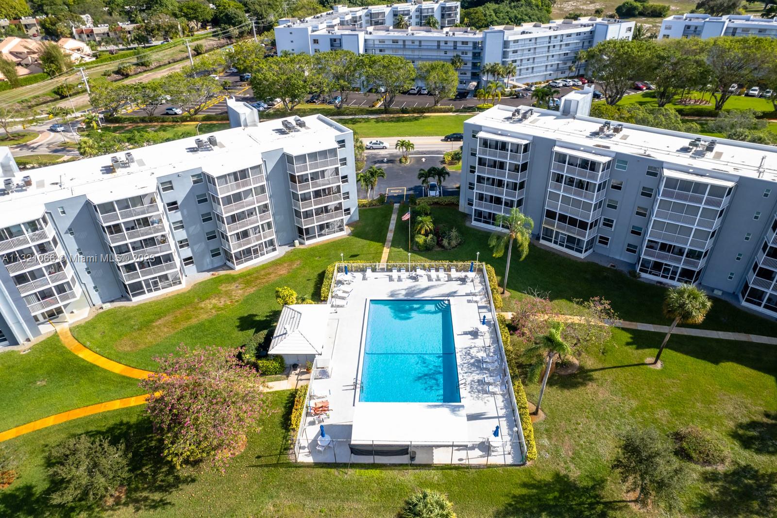 250 Northwest 67th Street, Unit 417 Boca Raton, FL 33487 - Photo 27 of 27 a view of a city with tall buildings