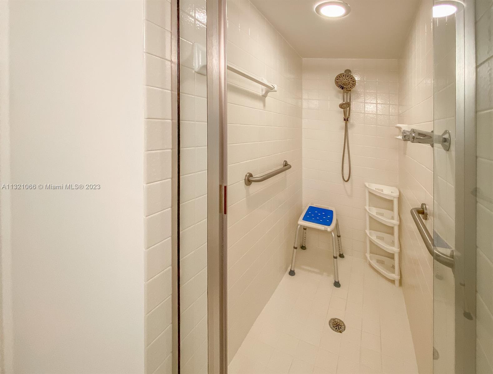 250 Northwest 67th Street, Unit 417 Boca Raton, FL 33487 - Photo 8 of 27 a bathroom with a tub and a shower