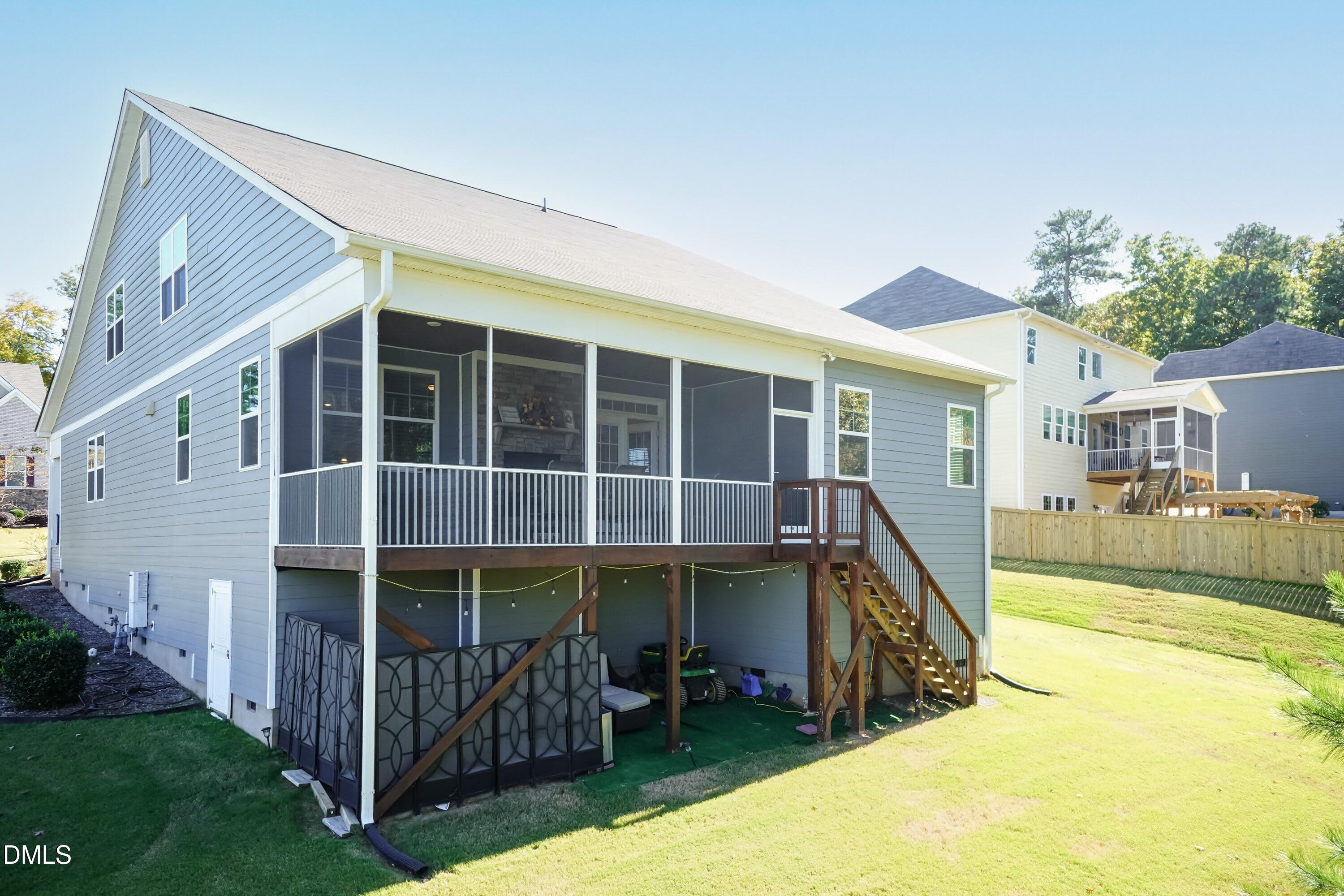 1009 Crescent Moon Court Durham, NC 27712 - Photo 10 of 57 a view of a house with backyard and porch