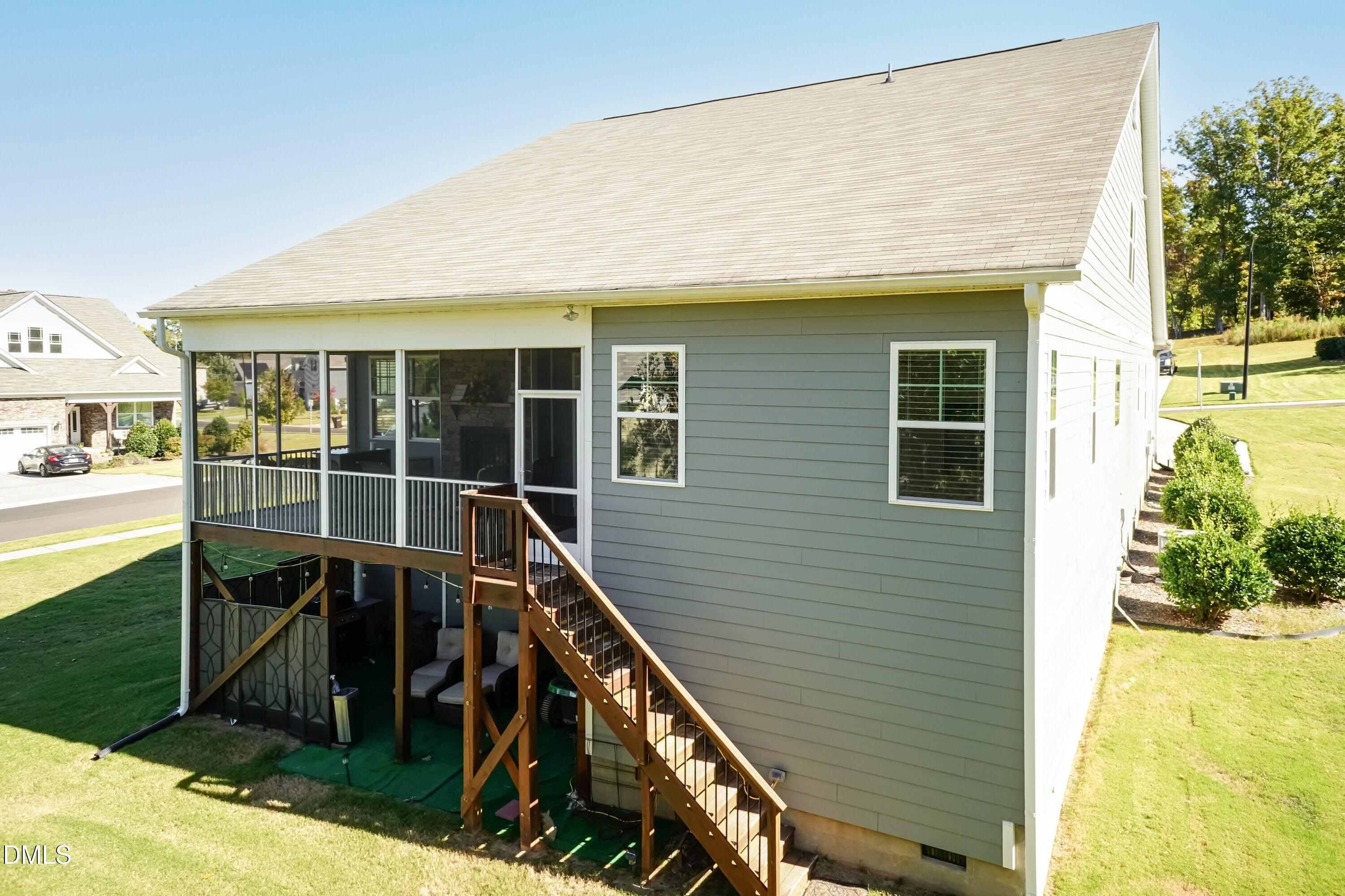 1009 Crescent Moon Court Durham, NC 27712 - Photo 17 of 57 a view of a house with a backyard