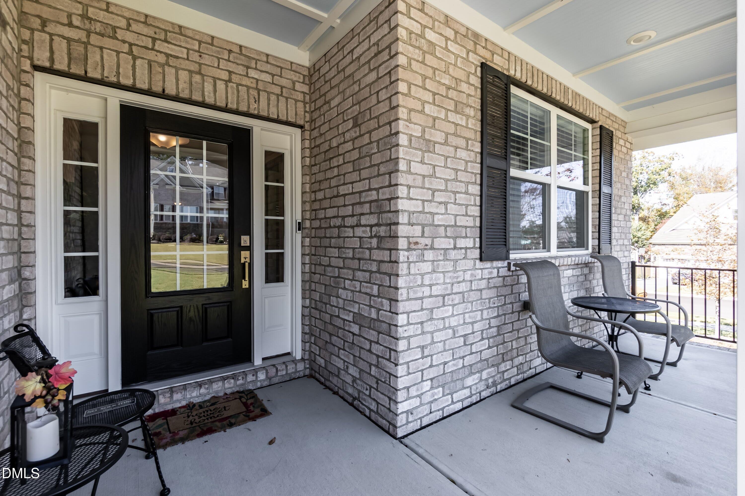 1009 Crescent Moon Court Durham, NC 27712 - Photo 18 of 57 a brick building with a bench and a window