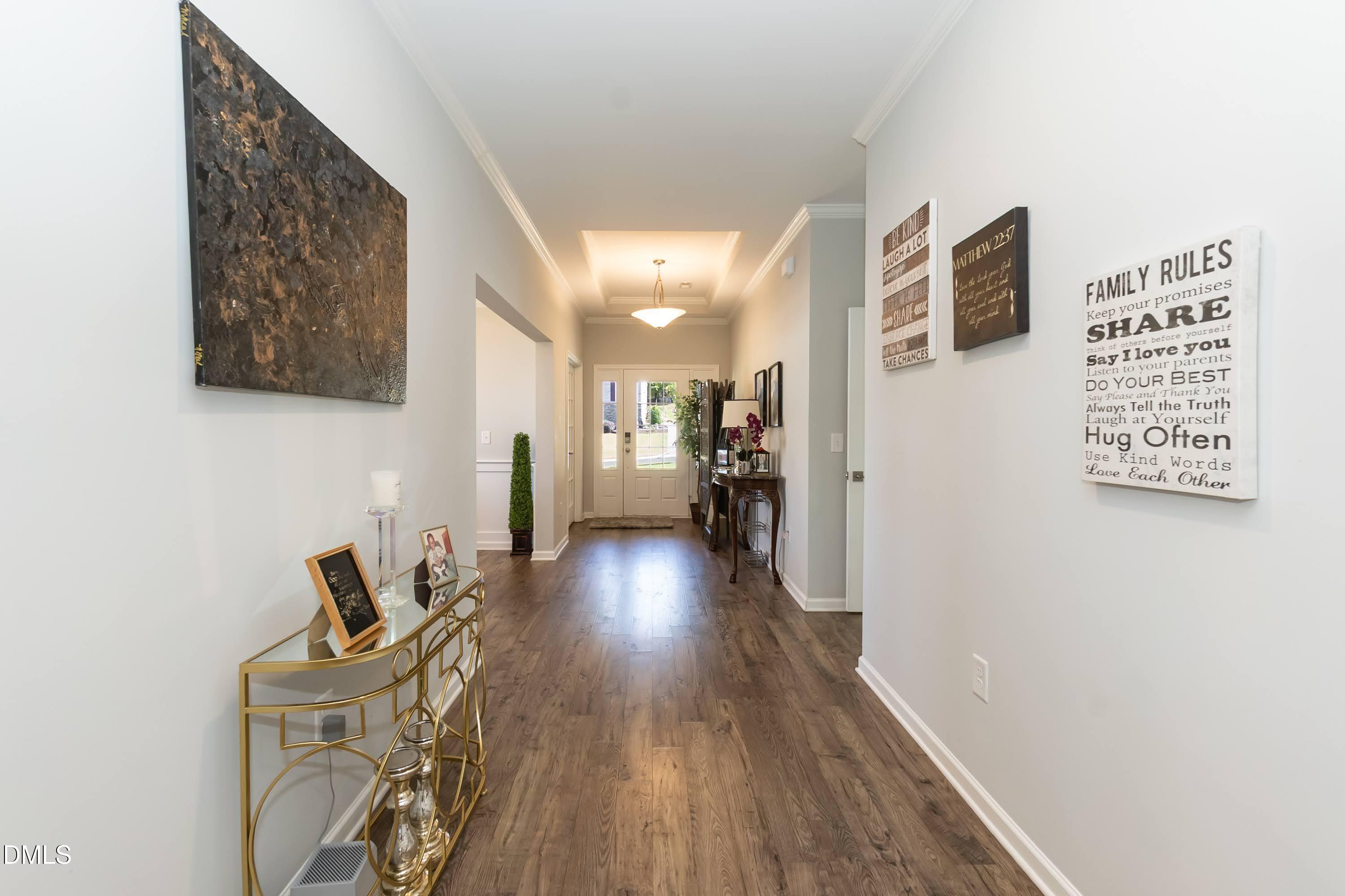 1009 Crescent Moon Court Durham, NC 27712 - Photo 20 of 57 a view of a hallway with wooden floor