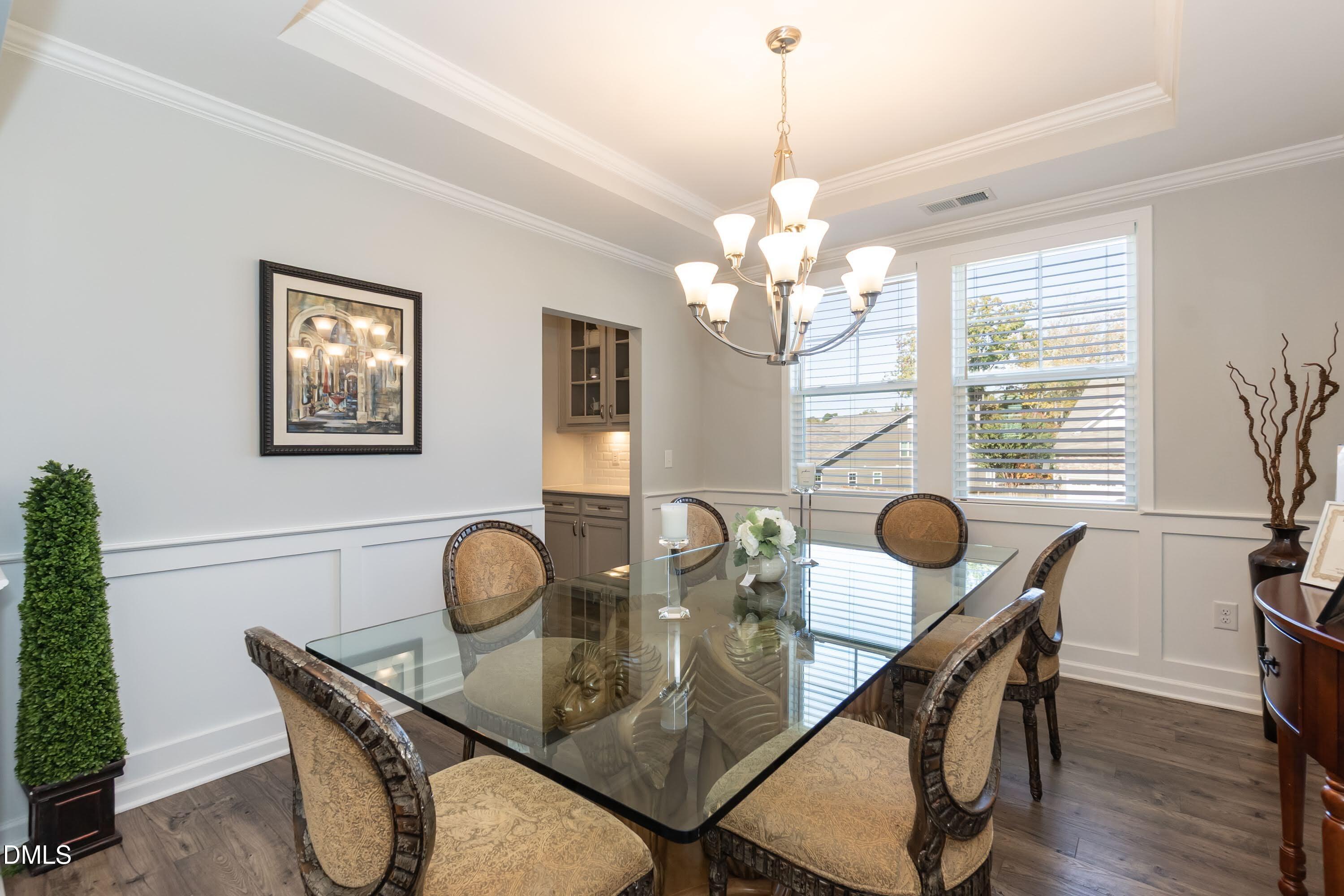 1009 Crescent Moon Court Durham, NC 27712 - Photo 22 of 57 a view of a dining room with furniture and chandelier