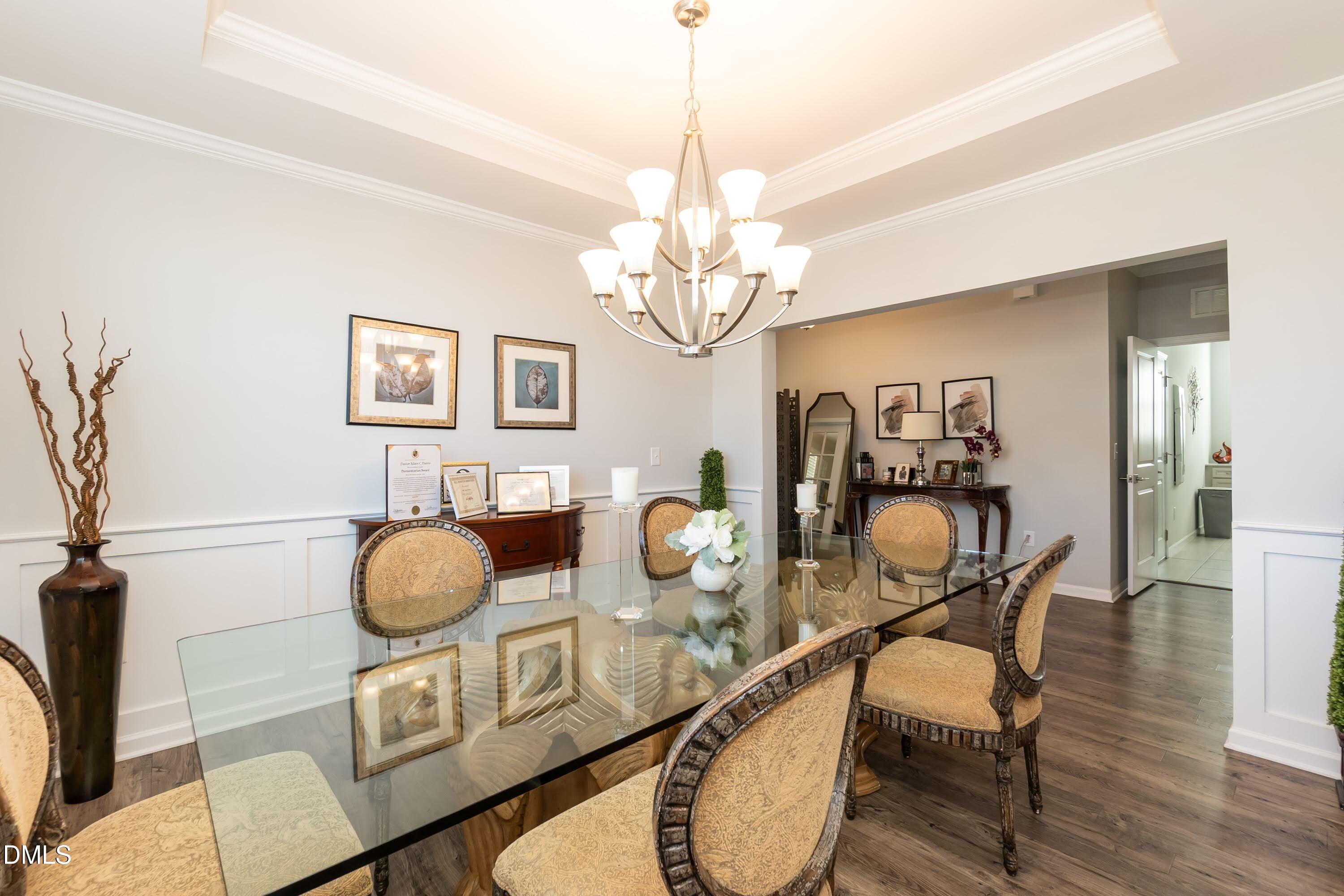 1009 Crescent Moon Court Durham, NC 27712 - Photo 23 of 57 a view of a dining room with furniture and wooden floor