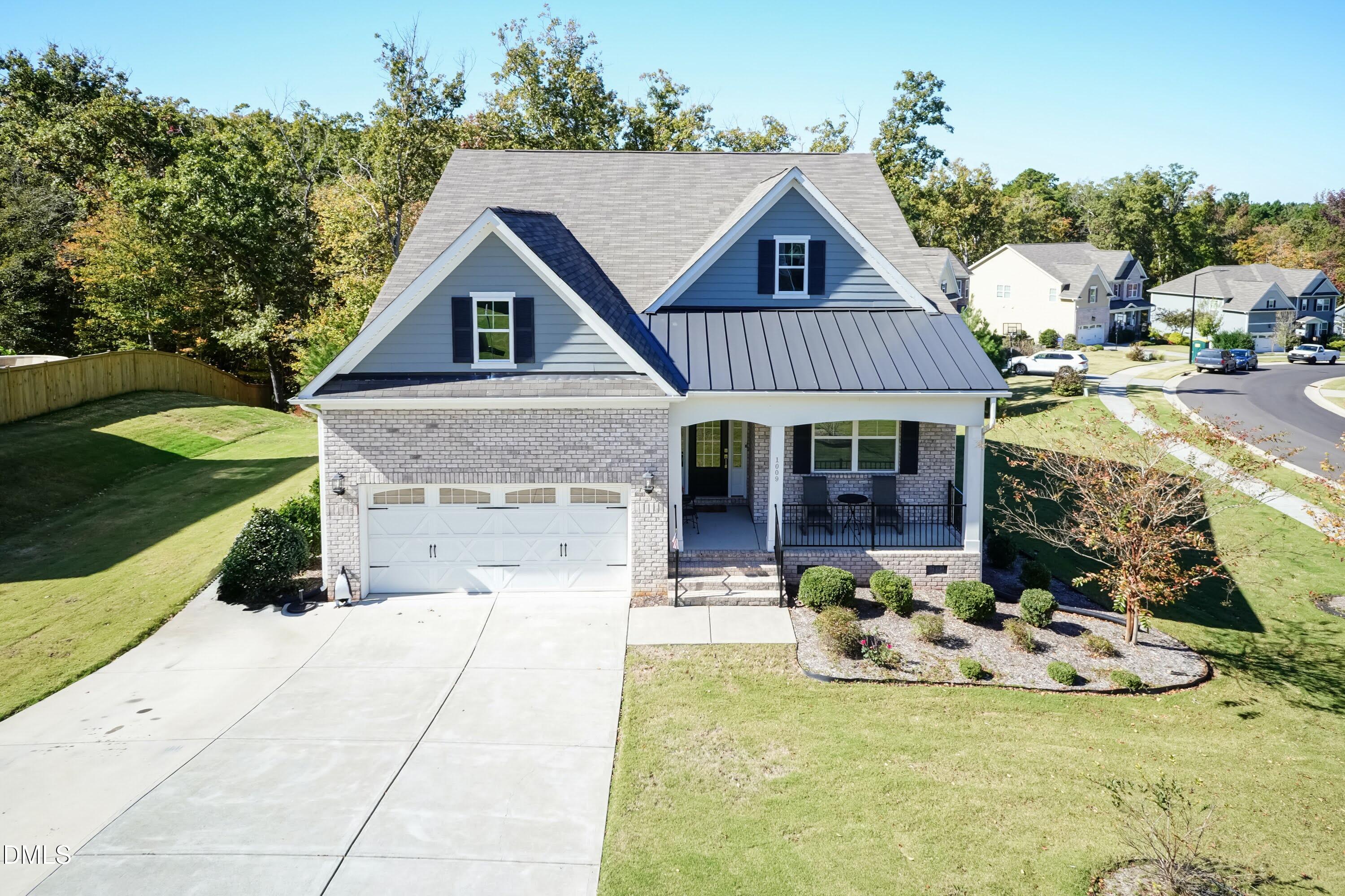 1009 Crescent Moon Court Durham, NC 27712 - Photo 2 of 57 a front view of a house with garden