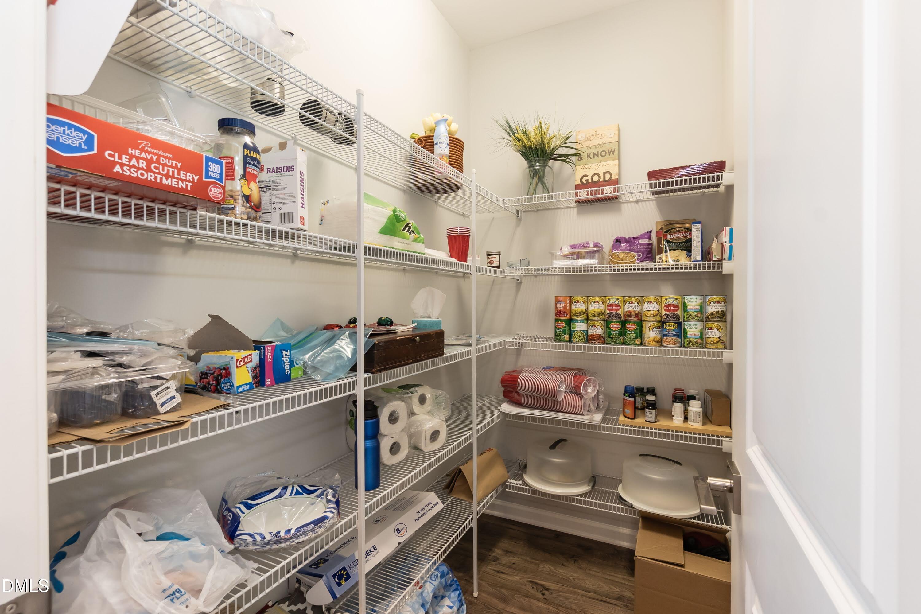 1009 Crescent Moon Court Durham, NC 27712 - Photo 31 of 57 a store room with granite countertop lots of different kinds of food