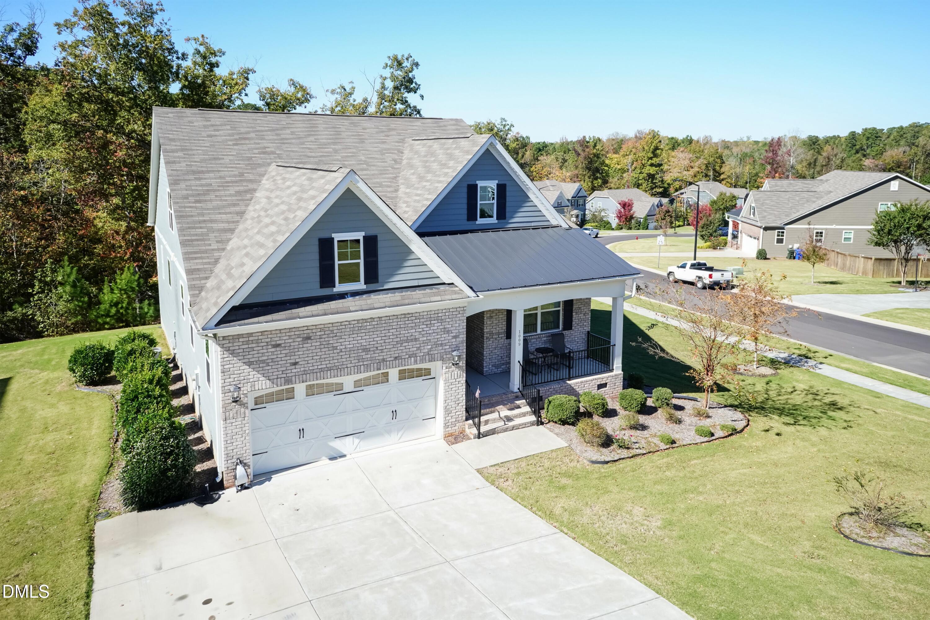 1009 Crescent Moon Court Durham, NC 27712 - Photo 3 of 57 an aerial view of a house with a yard