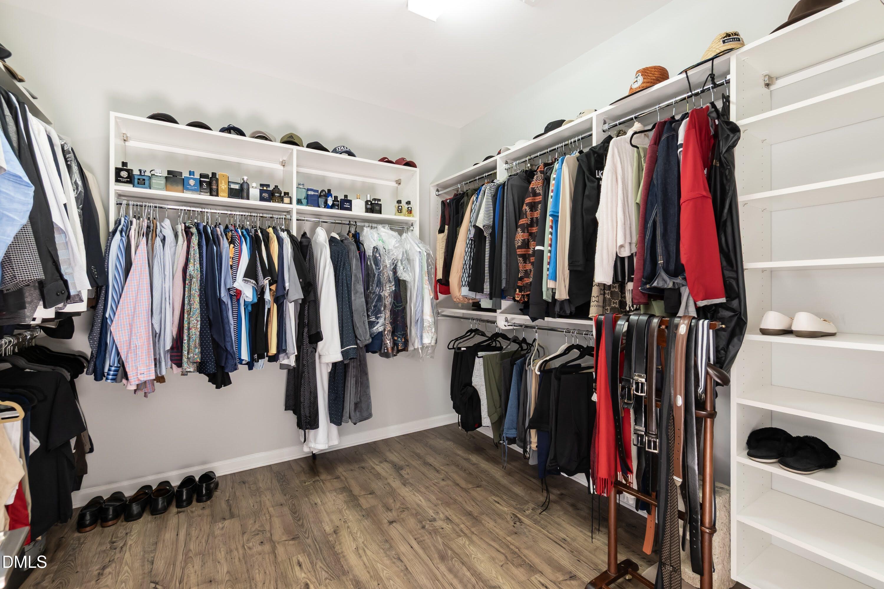 1009 Crescent Moon Court Durham, NC 27712 - Photo 44 of 57 a view of walk in closet with clothes and shoes