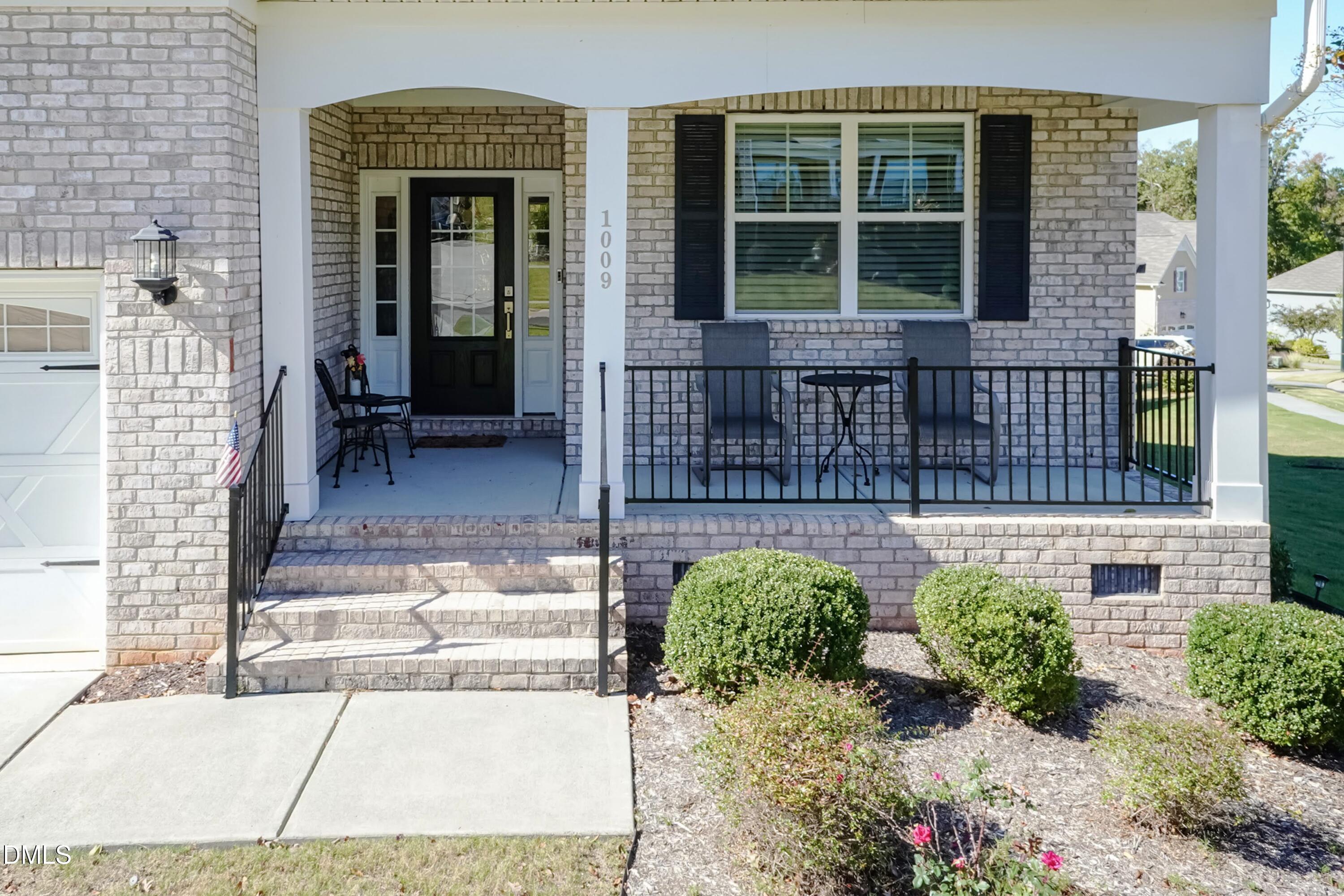 1009 Crescent Moon Court Durham, NC 27712 - Photo 4 of 57 a front view of a house with a garden