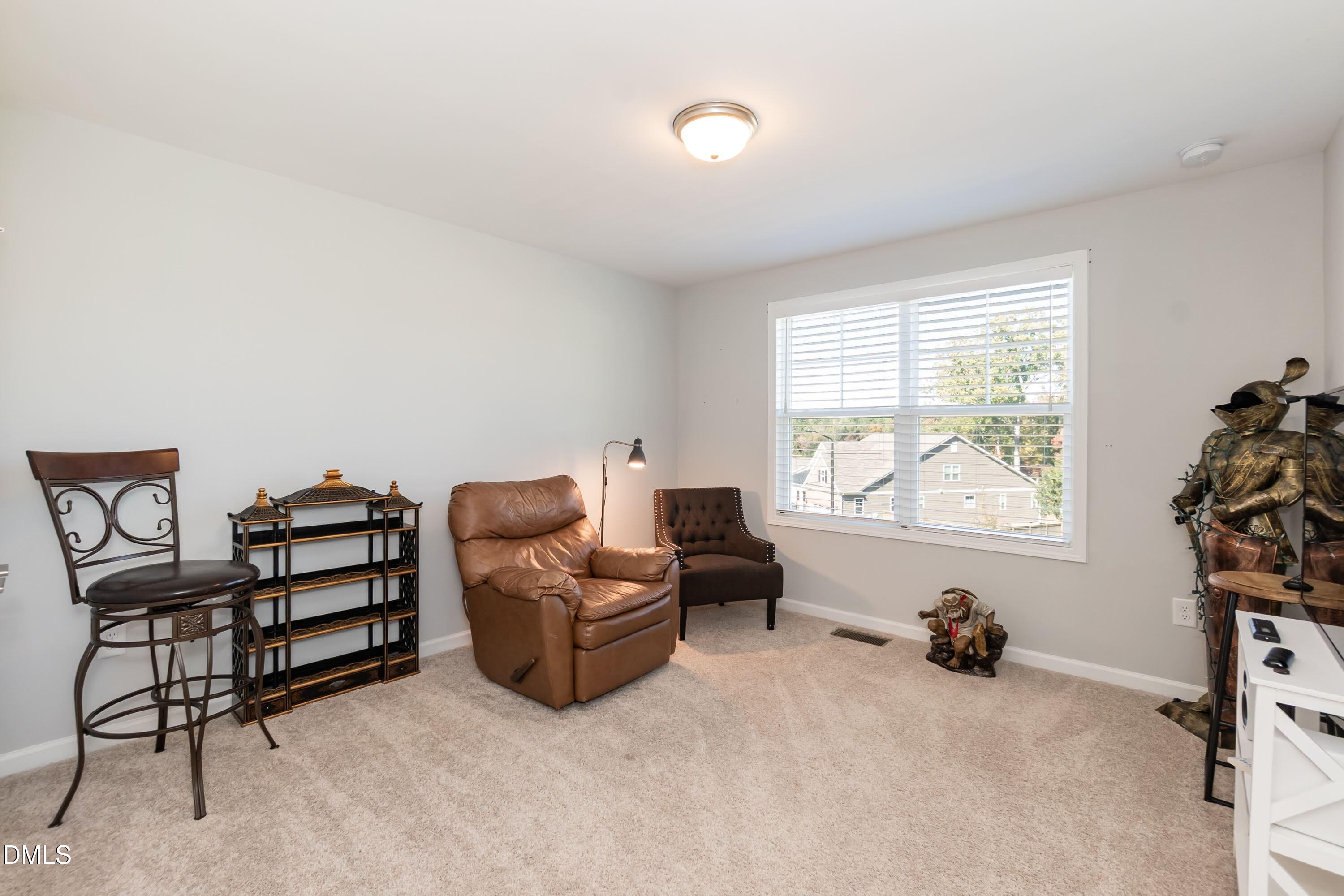 1009 Crescent Moon Court Durham, NC 27712 - Photo 50 of 57 a bed room with furniture and a window