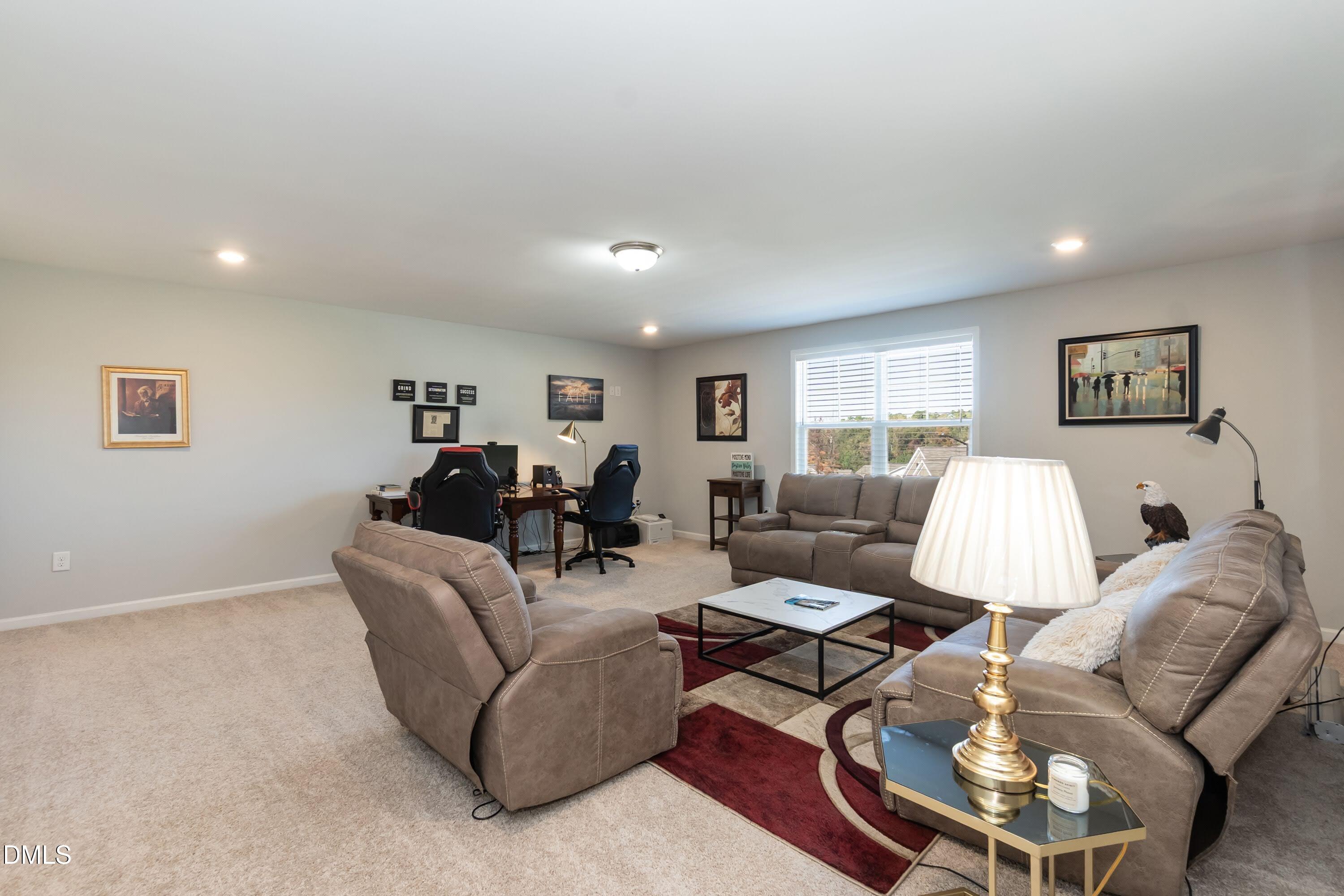 1009 Crescent Moon Court Durham, NC 27712 - Photo 51 of 57 a living room with furniture and a lamp