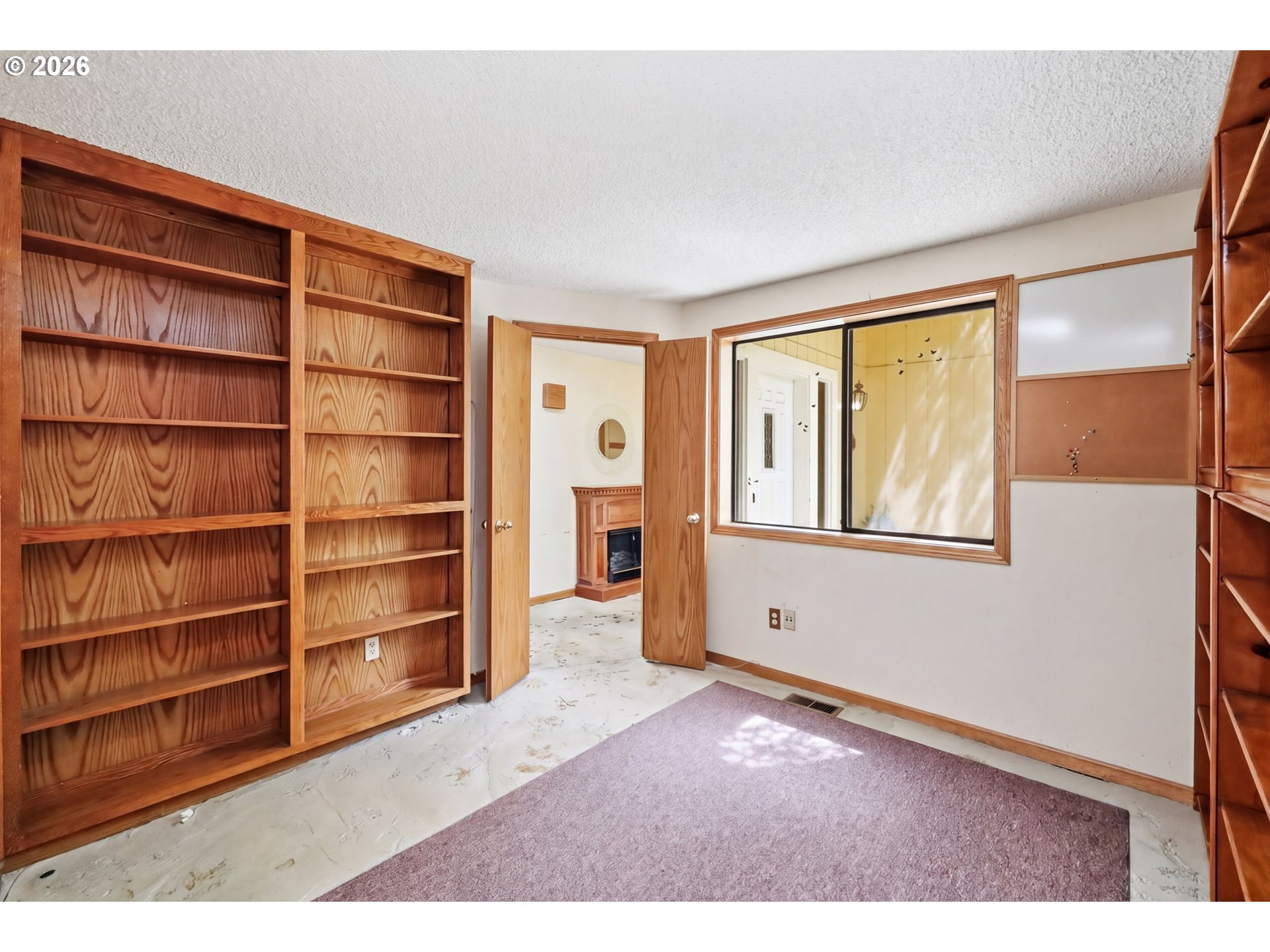 2983 Timberline Drive Eugene, OR 97405 - Photo 23 of 31 a view of an empty room with cabinet and a window