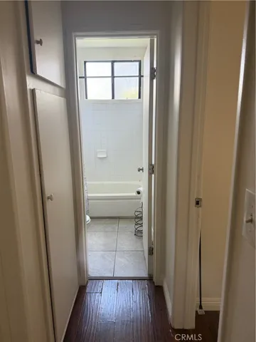 a view of bathroom with wooden floor