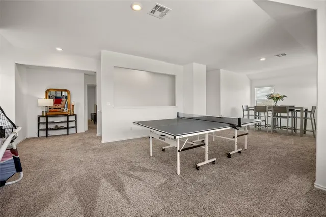 a living room with furniture and a table