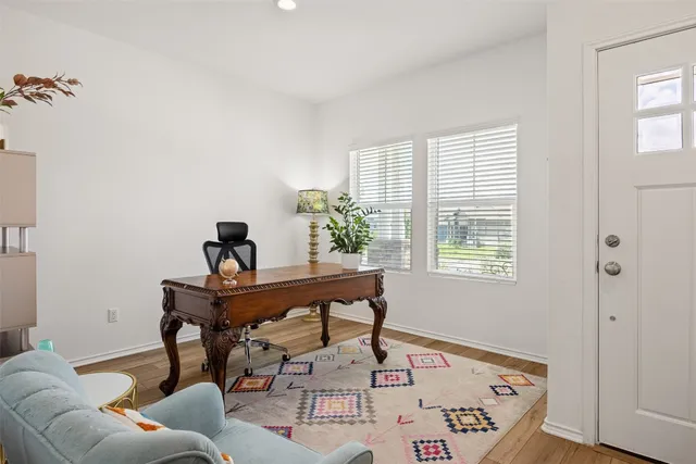 a living room with furniture and window