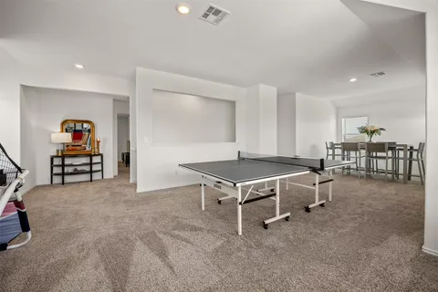 a living room with furniture and a table
