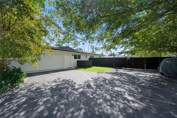 a backyard of a house with lots of green space