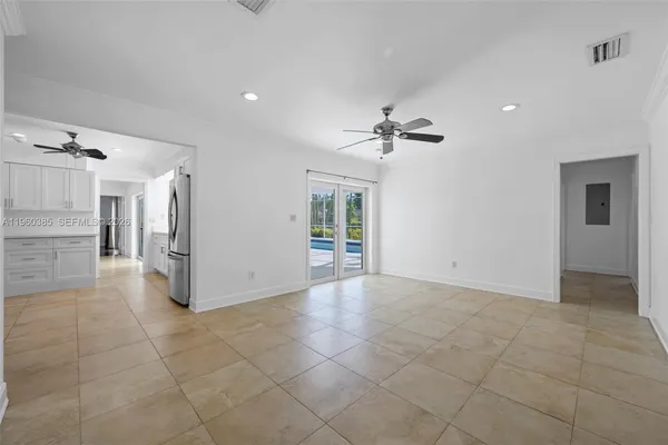 a view of a livingroom with a kitchen