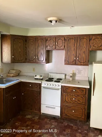 a kitchen with a sink and a stove