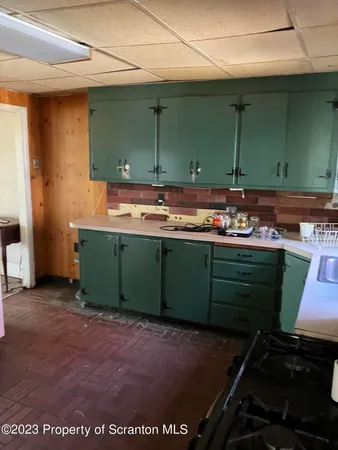 a room with a sink and a mirror