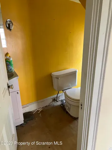 a bathroom with a toilet and a sink