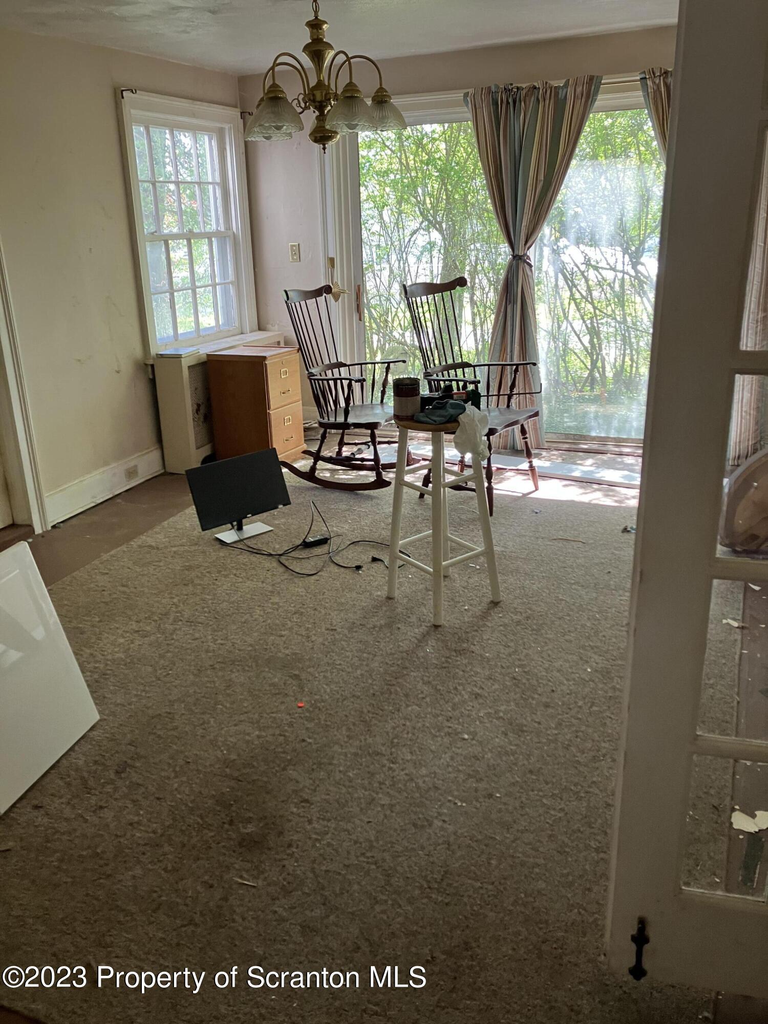 321 Maple Street Montrose, PA 18801 - Photo 17 of 28 a living room with furniture and a large window
