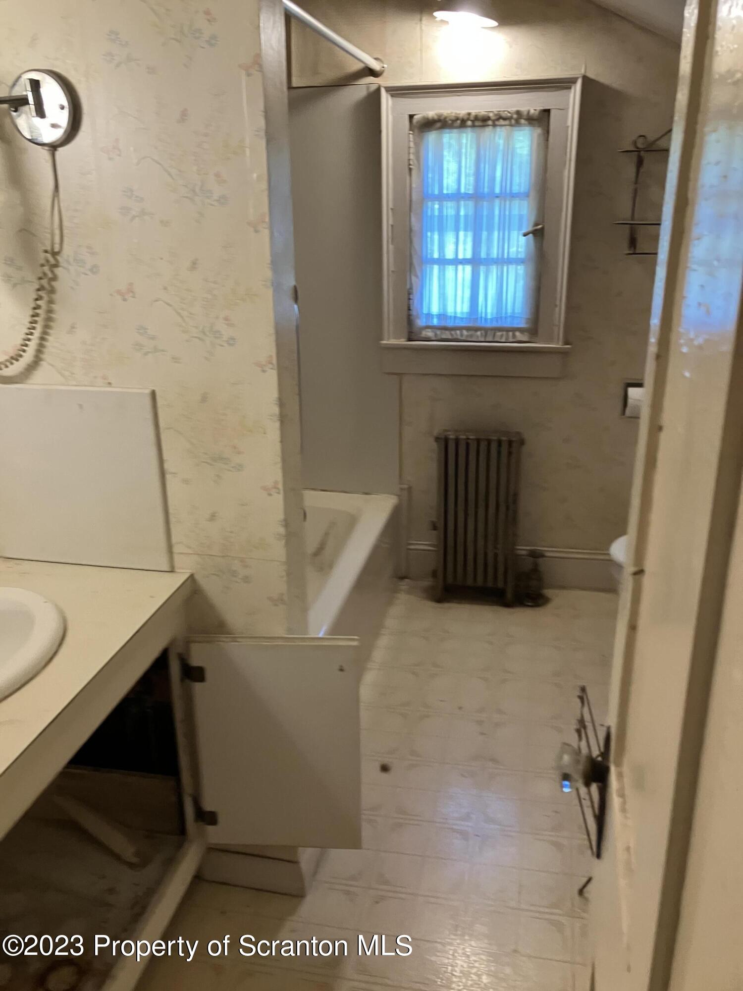 321 Maple Street Montrose, PA 18801 - Photo 20 of 28 a bathroom with a sink and a mirror