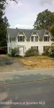 a front view of a house with a ocean view